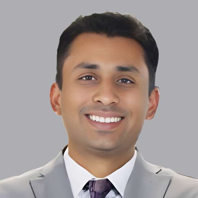 Kartik Subramaniam-Headshot-Gray Background.jpg